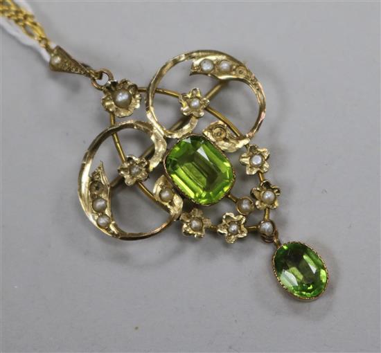 An Edwardian 9ct gold seed pearl and green stone set scroll pendant, on a 9ct gold fine link chain, pendant 44mm.